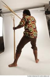 Man Adult Average Black Fighting with spear Standing poses Coat